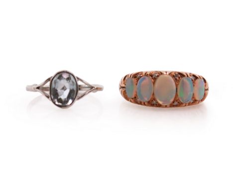 An opal and diamond five stone ring, size O, with an aquamarine solitaire ring, set in 9ct white gold, Birmingham hallmarks f