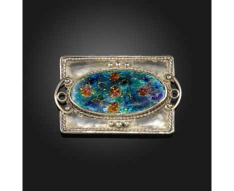 An Arts &amp; Crafts silver and polychrome enamel brooch, of rectangular form with an oval enamel floral plaque and wirework 