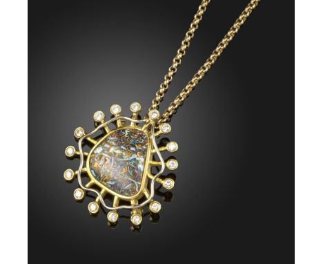 A boulder opal and diamond pendant by Martin White, the opal set within a surround of sixteen round brilliant-cut diamonds in