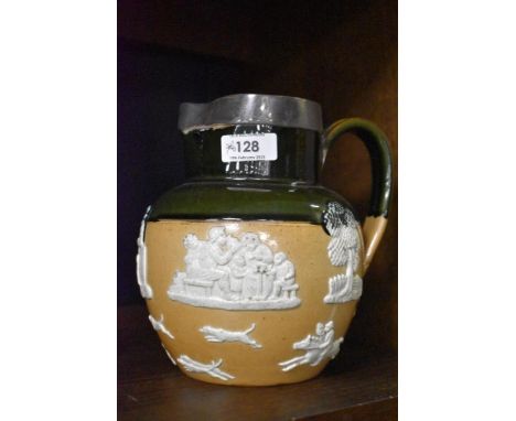 A Royal Doulton stoneware hunting jug with applied silver rim and two-tone globular body moulded with hunting motifs, impress