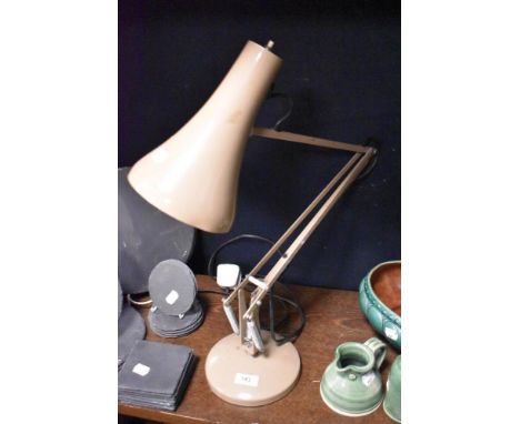 A vintage Anglepoise style adjustable lamp in brown.