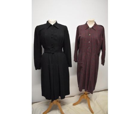 A 1930s black twill day dress/ chore dress with self covered buttons to front and belt to waist and pleated skirt and a simil