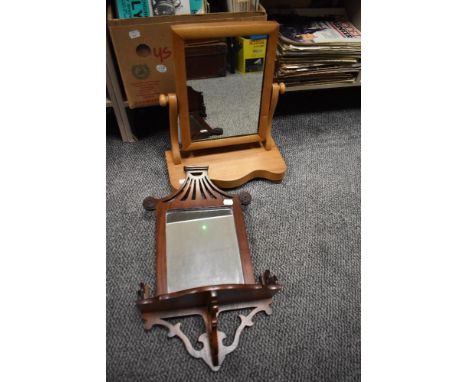 An early 20th century toilet mirror and a modern mahogany Chippendale style wall mirror