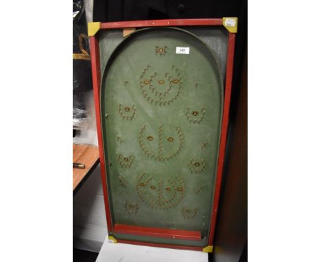 A vintage childrens toy bagatelle game board