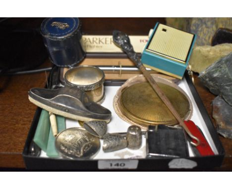 A collection of curios and trinkets including HM silver items, cigarette lighter and make up compact