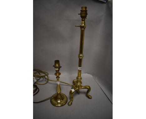 A fine early 20th century adjustable brass reading lamp having tripod lions feet base with a similar lamp.
Extending lamp mea