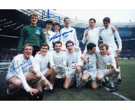 Autographed LEEDS UNITED Football photo, a superb image depicting players celebrating with the League Cup after victory over 