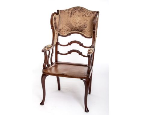 A VERY UNUSUAL MAHOGANY WINGBACK ARMCHAIR, with the trade label of J.A.S.Shoolbred and Company. Ladder back and shaped side r