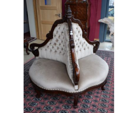 A VERY ATTRACTIVE CARVED WALNUT THREE SEATER CENTRE SETTEE, with button backand bow fronted seat. Leaf carved frame, raised o