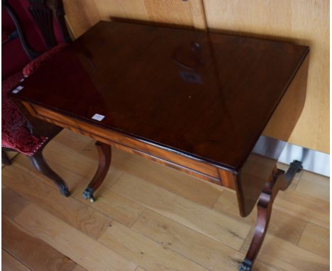 A VICTORIAN INLAID AND CROSSBANDED MAHOGANY SOFA TABLE, of small proportions.With two D-shaped flaps flanking three concealed