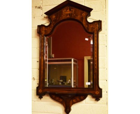 A FINE ROSEWOOD AND MARQUETRY INLAID SHIELD SHAPED MIRROR WALL BRACKET.Moulded cornice above an inlaid frieze with central ur