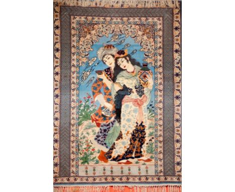 A FINE PERSIAN PICTORIAL CARPET. Depicting a male and female against a light blue andivory ground. The lady holding a vase, h