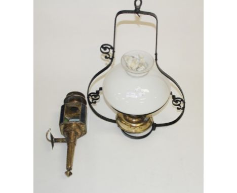 TWO EDWARDIAN BRASS HANGING CEILING LIGHTS. One with milk glass globe. Togetherwith a copper carriage lamp. (3)