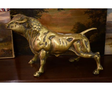 A HEAVY BRASS MODEL OF A BULL, twentieth and twenty first century, in attack position, probably Spanish, 17" (23cm) high. (1)