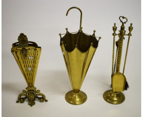AN UMBRELLA SHAPED BRASS STICK AND UMBRELLA STAND. A peacock tail shapedpierced brass fire screen and a five piece brass fire