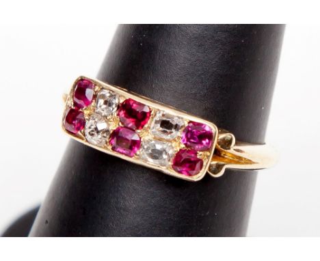 AN ATTRACTIVE RUBY AND DIAMOND RING. 18K yellow gold setting, with six rubies and four
old cut diamonds. (1)