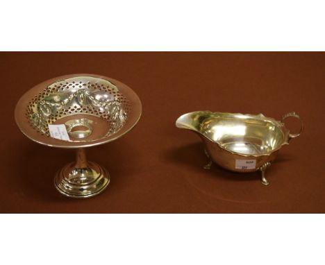 A STEMMED AND PIERCED SILVER TAZZA, Sheffield 1908, with weighted base. Together with a silver helmet shaped sauce boat, Birm