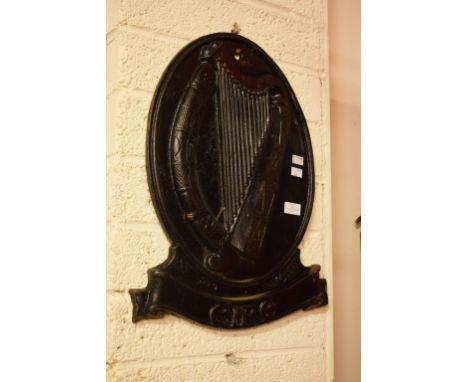 A HEAVY CAST IRON EIRE CREST WITH HARP. Of oval form. 21" (54cm) high x 17" (43cm)wide. (1)
