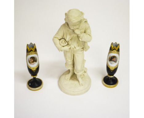 A VICTORIAN PARIAN FIGURE, modelled as a boy holding a nest. As is. 16”41cm) high.Together with a pair of Bohemian dark glass