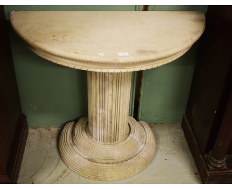 A CARVED COMPOSITION SAND STONE CONSOLE TABLE. In three sections. Demi-lune andrope moulded top on a reeded stem and conformi
