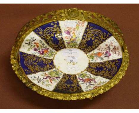 A PORCELAIN AND ORMOLU MOUNTED CAKE DISH,decorated with colourful flowers and birds within alternating panels of white and da
