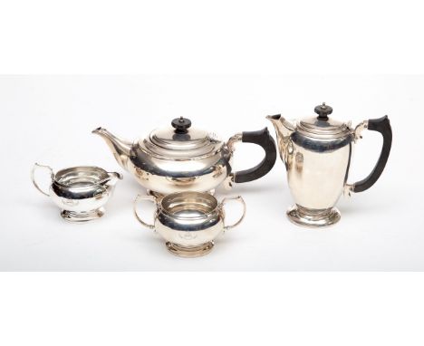 A FOUR PIECE SILVER CRESTED TEA AND COFFEE SERVICE, by Mappin & Webbs, Sheffield 1944. Comprising bulbous tea pot, with eboni
