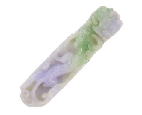 An antique Qing Dynasty Chinese lilac jade belt hook carved in detail to depict a chilong with undulating body grasping a lin