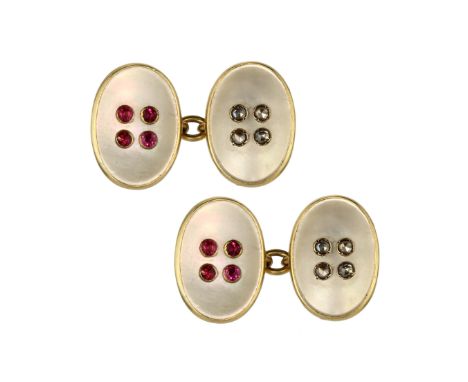 A pair of ruby, diamond and mother of pearl 'button' cufflinks in 18ct yellow gold designed with oval mother of pearl faces e