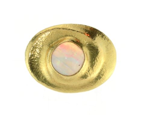 A vintage opal and diamond brooch in 18ct yellow gold signed PK, designed as a large cabochon cut opal within a textured, lay