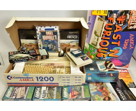 A BOXED AMIGA 1200 COMPUTER AND ACCESSORIES, a boxed Amiga 1200 computer along with three Amiga Format Presents VHS cassettes