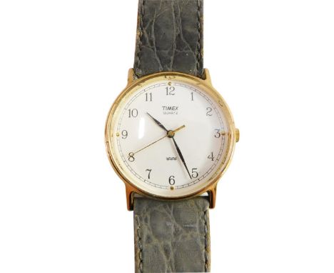 A Timex quartz gentleman's wristwatch, with gold plated outer case on a stainless steel back, with cream coloured dial, on a 