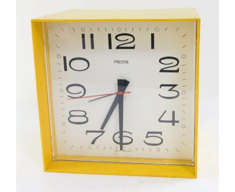 A Presta vintage 1970's yellow acrylic cased mantel clock, square dial bearing Arabic numerals, clockwork movement, 22.5cm hi