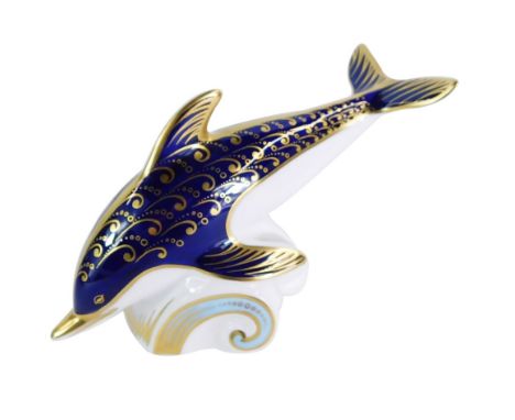 A Royal Crown Derby dolphin paperweight, riding the wave, gold stopper, 18cm wide, boxed.