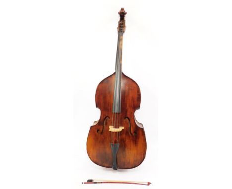 A Boosey &amp; Hawkes Double Strad double bass, 3/4 size, with a bow.