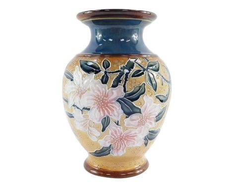 A Royal Doulton late 19thC stoneware vase, Art Union of London, with a blue glazed interior, decorated externally with white 