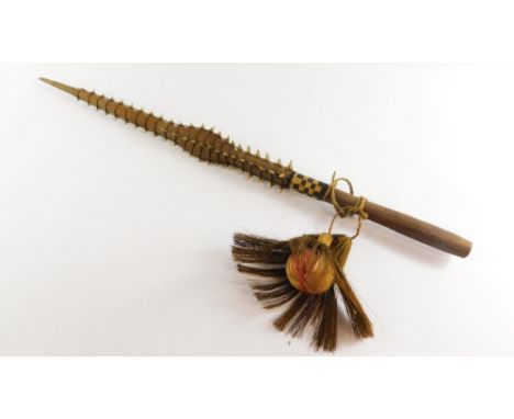 Tribal Art. A Gilbert Islands Tebutje dagger, with applied sharks teeth and hair drop ball, 78cm long. 
