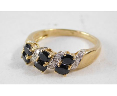 A 9ct gold dress ring, set with imitation diamond and sapphire stones, in crossover claw setting, size P½, 3g all in.