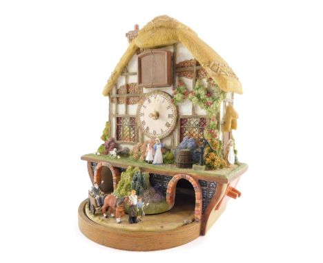 A Bradford Exchange Country Days cuckoo clock, 28cm high.