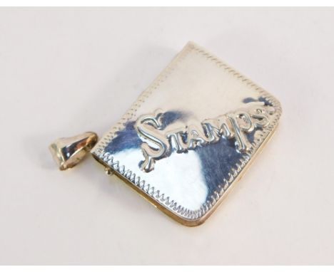 A silver stamp case, of book form, embossed 'Stamps' with plain back, ring chain attachment, stamped 925, 3.5cm wide.