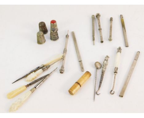 A group of silver and silver plated wares, mother of pearl handled and silver button hooks, silver and silver plated thimbles
