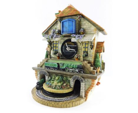 A Bradford Editions Memories of Steam Flying Scotsman clock, 32cm high.