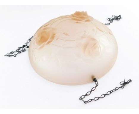 A 1960s pink glass light shade, with three rose detailing, on chain supports, 35cm diameter.