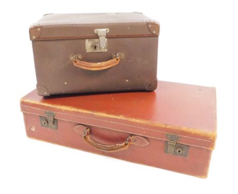 Two vintage travel cases, comprising a brown leather travel trunk, and a brown material trunk, largest 18cm high, 71cm wide, 