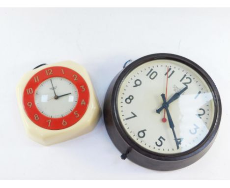 Two Art Deco Smiths electric wall clocks, comprising a Douglas clock with a cream case and red surround, 20cm x 20cm, and a b