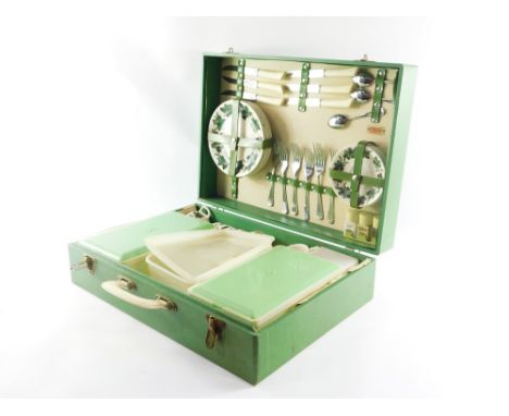 A Sirram picnic hamper, with ceramic leaf design pottery and plastic tupperware, 20cm high, 49cm wide, 36cm deep.