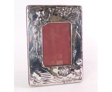 An Art Nouveau style silver photograph frame, the outer rim with embossed figures of females picking roses, maker's stamp PJP