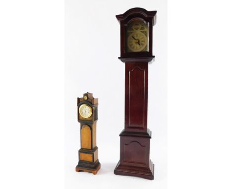 Two miniature grandfather clocks, comprising Kibley Craft grandfather clock, 22cm high, and another mahogany finish example, 