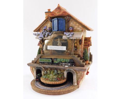A Bradford Editions Memories of Steam Flying Scotsman wall mounted clock, in polystyrene casing, with four drop weights, 33cm