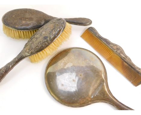 A silver dressing table set, comprising a George V silver hand mirror and brush, with channeled detailing, Birmingham 1922, t