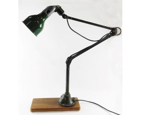 A 1920's Mek Elek anglepoise industrial lamp, with green shade and metal fittings, on a wooden base, approx 85cm high when sh